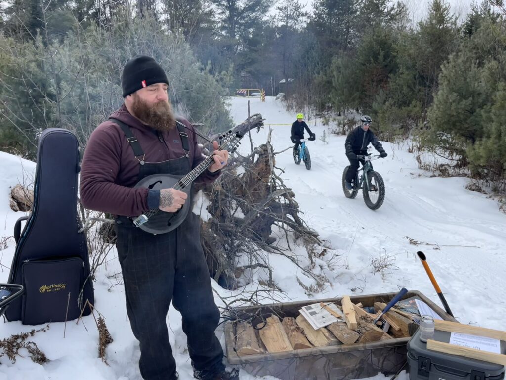 About Us frank with a klos mandolin at the fatbike race